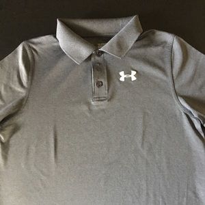 Boys Under Armour dark grey golf shirt.